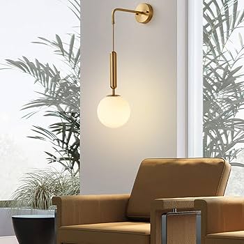 Modern, adjustable brass-finish wall sconce with a glass globe shade